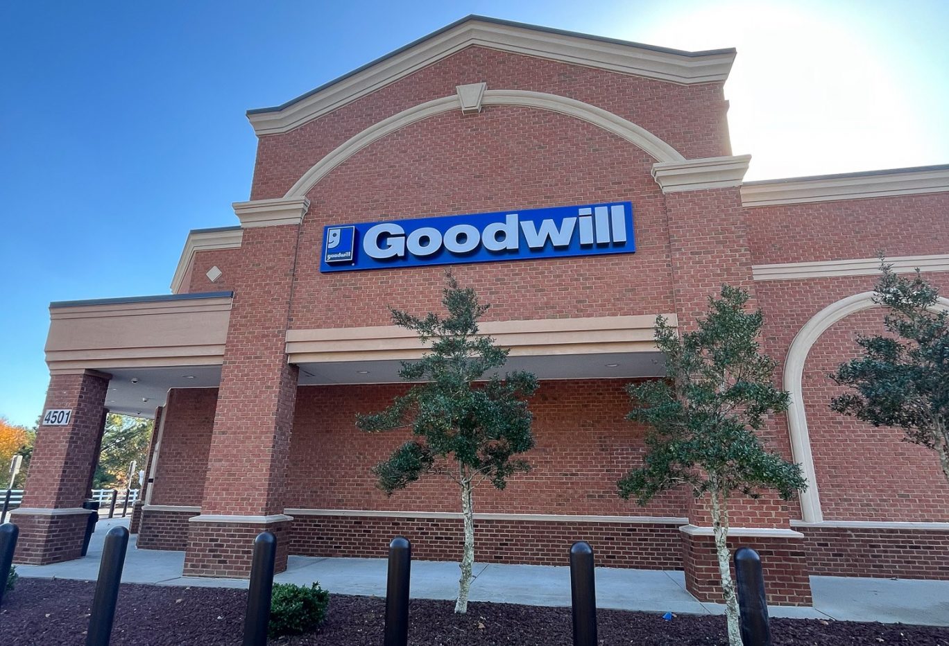 New Goodwill store in Williamsburg on 4501 News Road. Photo shows brick building with Goodwill sign mounted on the side.