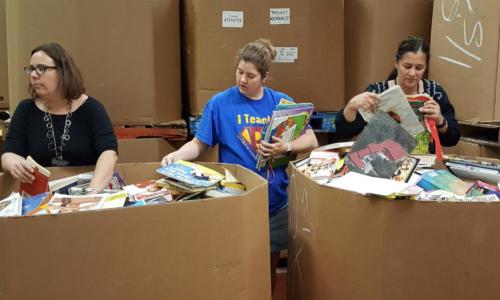 Teachers Digging for Free Books at Goodwill